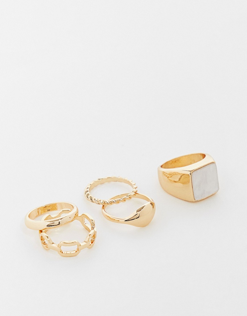 ASOS DESIGN pack of 5 rings with faux pearl signet design in gold tone