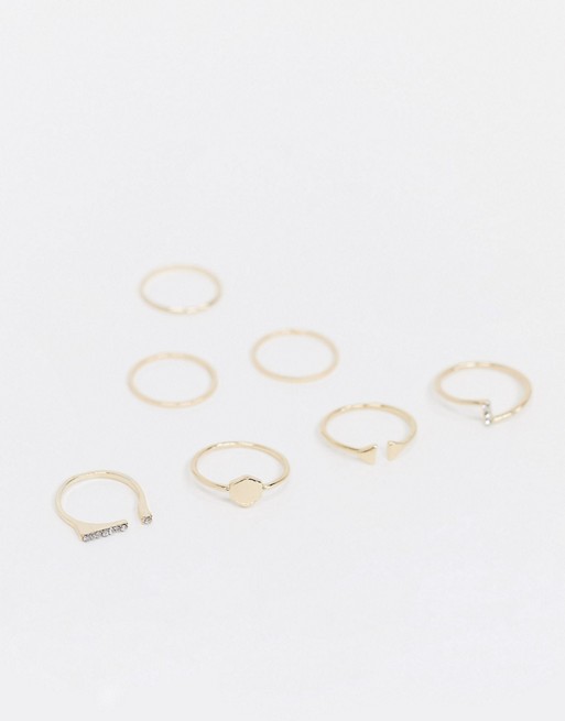 ASOS DESIGN pack of 7 rings with mixed designs in gold tone