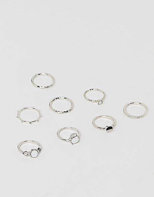 ASOS DESIGN pack of 8 rings with faux moonstone and engraved detail in silver