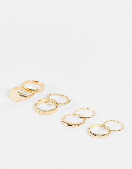 ASOS DESIGN pack of 8 rings with mixed minimal designs in gold tone ASOS