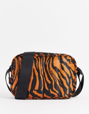 ASOS DESIGN padded nylon crossbody bag in tiger print