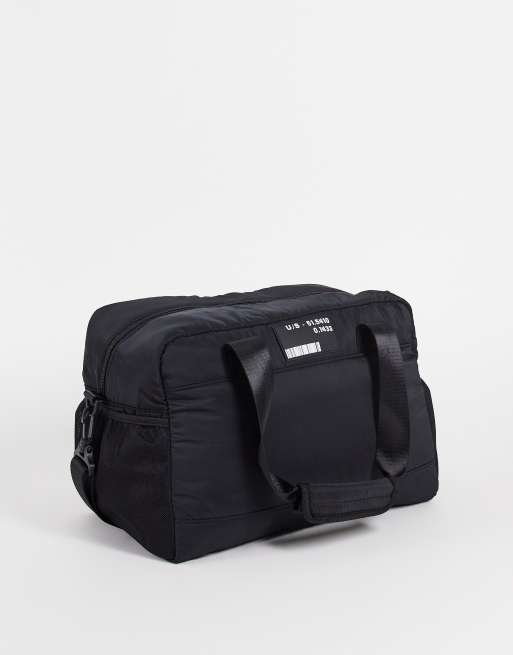 ASOS DESIGN padded nylon holdall with branding in black 22 litres