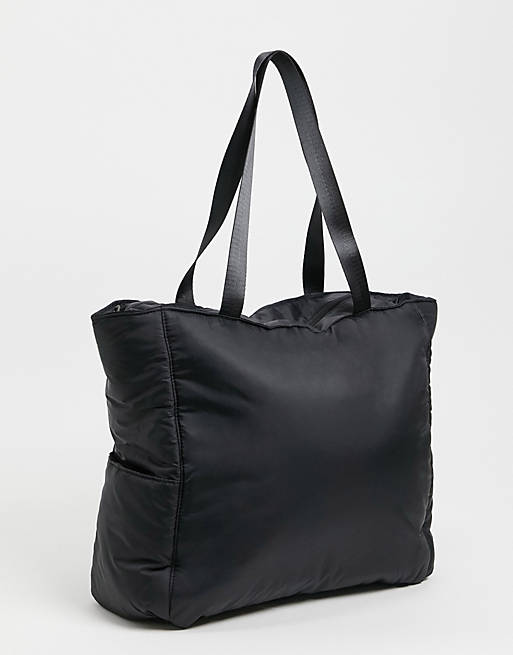 ASOS DESIGN padded tote bag in black nylon with side pockets
