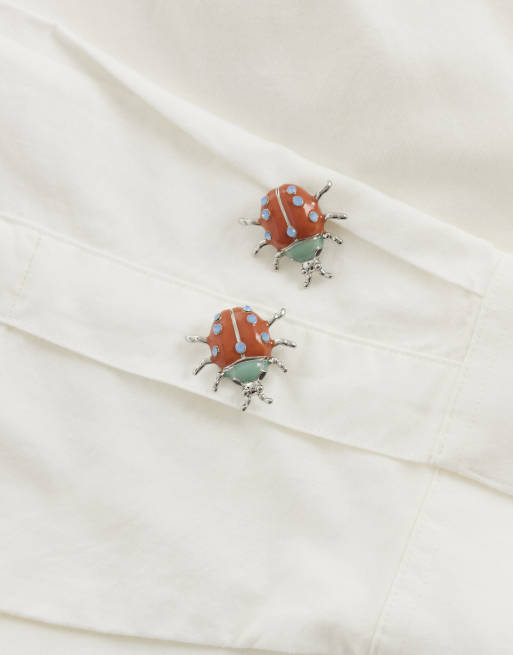 ASOS DESIGN - Paire de cache-boutons façon boutons de manchette en résine à imprimé coccinelle, 2 de 3
