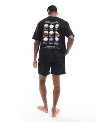 pajama set with solar system print in black