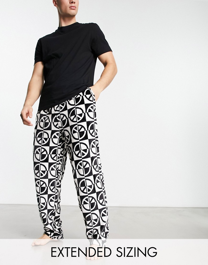 ASOS DESIGN pajama set with t-shirt and pants in black with fleece printed bottom