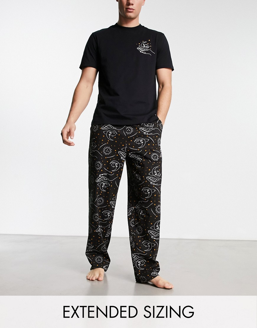 ASOS DESIGN pajama set with t-shirt and pants in black with space print