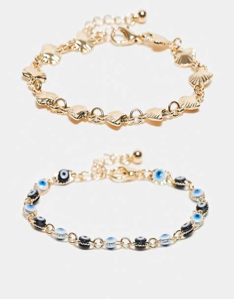 ASOS DESIGN - Pakke med 2 guldfarvede armbånd med skal- og øjedetaljer - view 1