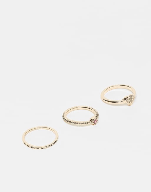 ASOS DESIGN - Pakke med 3 guldfarvede ringe med hjertedesign og glitrende lyserød krystaldetalje, 3 af 3
