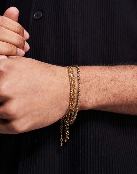 ASOS DESIGN - Pakke med 4 guldfarvede armbånd med blandede kæder i vandfast rustfrit stål - view 1