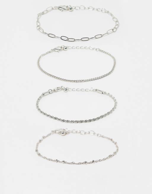 ASOS DESIGN - Pakke med 4 guldfarvede armbånd med smalle kæder