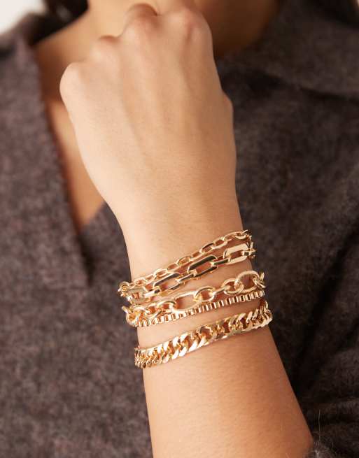 ASOS DESIGN - Pakke med 5 guldfarvede stable-armbånd med forskellige kæder, 3 af 3