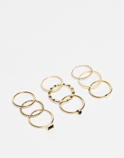 ASOS DESIGN - Pakke med 9 guldfarvede ringe med sort emaljedesign