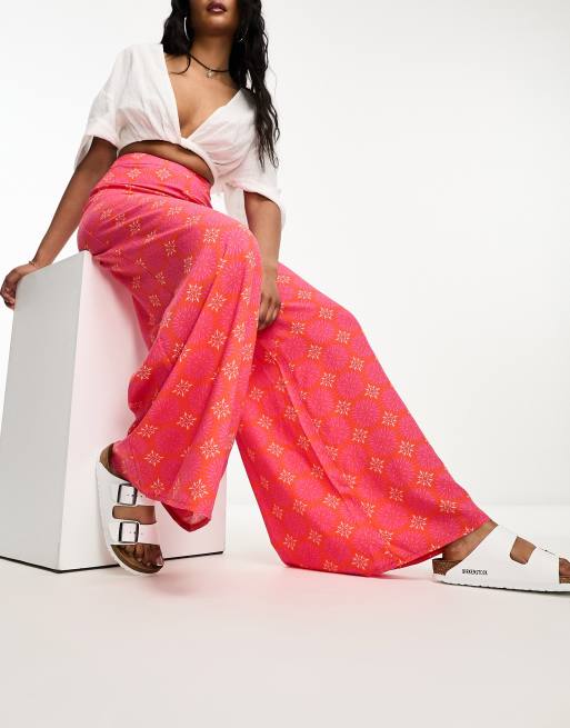 ASOS DESIGN palazzo pants in pink geo print