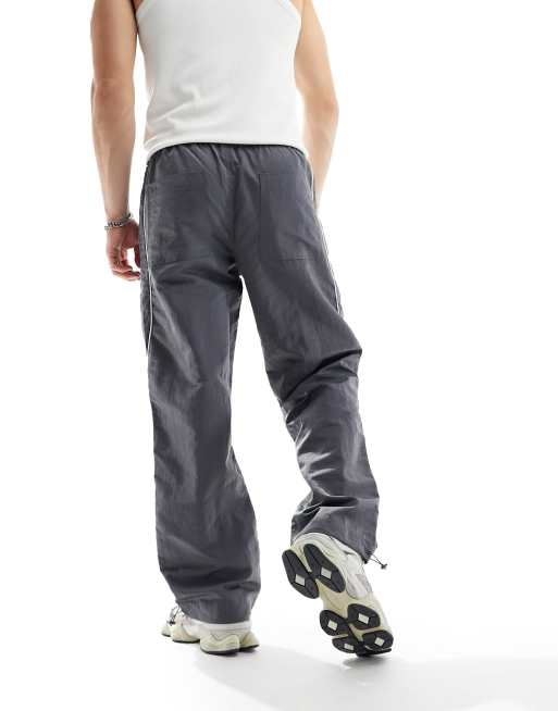 ASOS DESIGN paneled piping track pants in gray and white sheen nylon