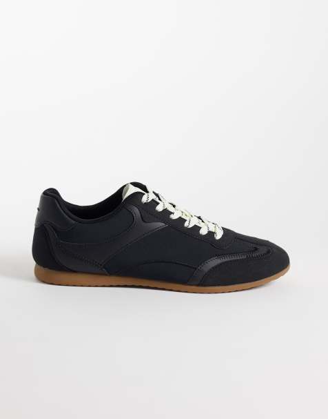 ASOS DESIGN paneled retro sneakers in black - view 1
