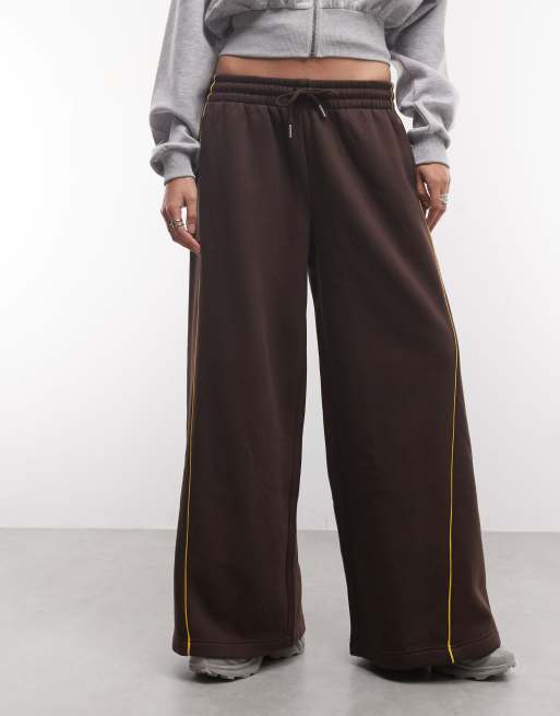 ASOS DESIGN panelled extreme wide leg jogger with piping details in brown and yellow, 2 of 5