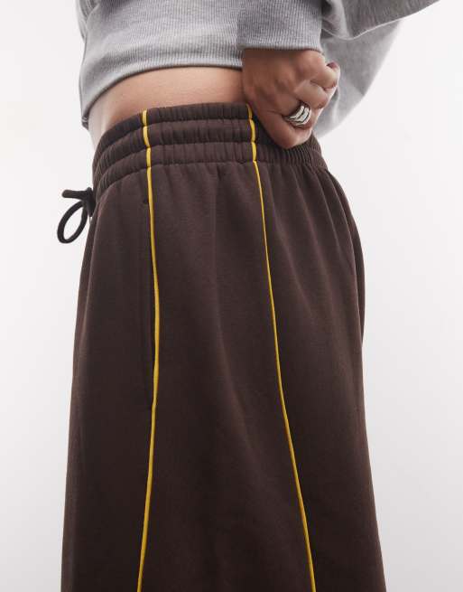 ASOS DESIGN panelled extreme wide leg jogger with piping details in brown and yellow, 4 of 5