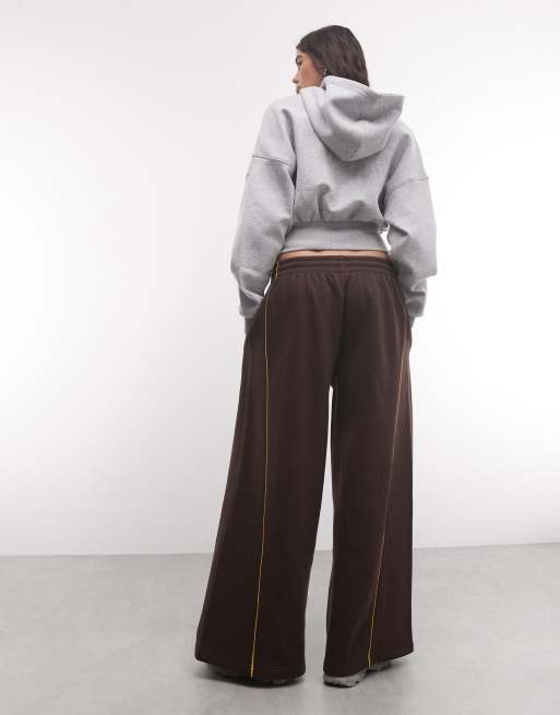 ASOS DESIGN panelled extreme wide leg jogger with piping details in brown and yellow, 5 of 5