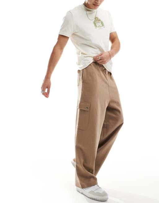 ASOS DESIGN - Pantalon coupe ballon avec poche cargo - Marron