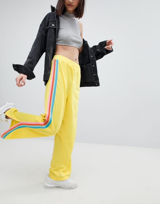 ASOS DESIGN Pantalon de jogging avec bande arc en ciel sur le