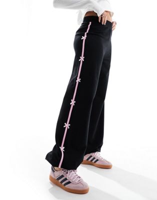 ASOS DESIGN - Pantalon de jogging avec bande latérale à nœuds - Noir