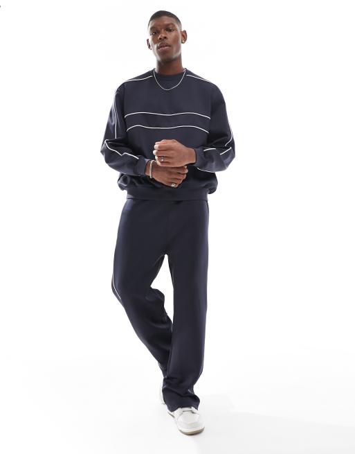 ASOS DESIGN - Pantalon de jogging d'ensemble ample en néoprène avec liseré - Bleu marine