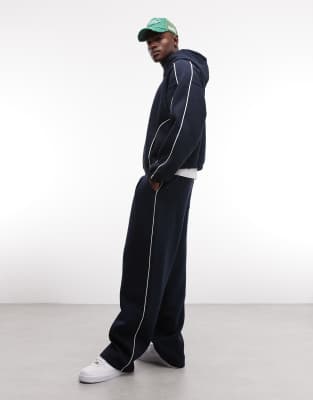 ASOS DESIGN - Pantalon de jogging d'ensemble ultra-baggy à liserés latéraux - Bleu marine