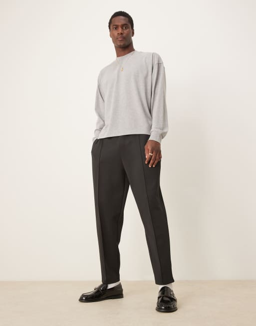 ASOS DESIGN - Pantalon de jogging fuselé décontracté en néoprène à plis nervurés - Noir