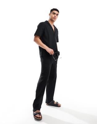 ASOS DESIGN - Pantalon d'ensemble décontracté en broderie anglaise avec taille élastique - Noir