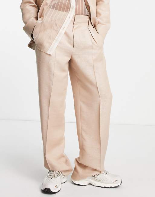 ASOS DESIGN - Pantalon met wijde pijpen en glimmend hoogglans in goud
