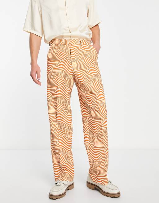 ASOS DESIGN - Pantalon met wijde pijpen en wervelprint in wit en oranje
