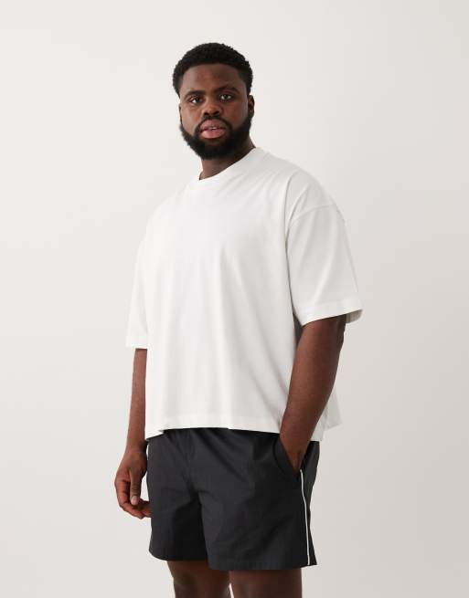 ASOS DESIGN - Pantaloncini ampi di media lunghezza elasticizzati in nylon neri con profili a contrasto, 2 di 6