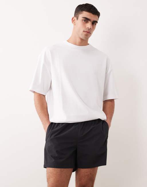 ASOS DESIGN - Pantaloncini ampi di media lunghezza elasticizzati in nylon neri con profili a contrasto, 4 di 6