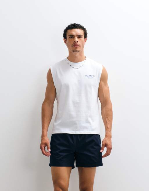 ASOS DESIGN - Pantaloncini ampi lunghezza media elasticizzati in nylon blu navy con profili a contrasto, 2 di 9