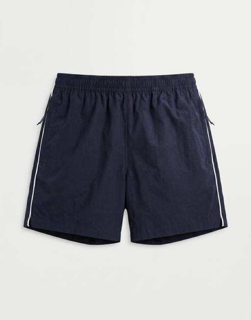 ASOS DESIGN - Pantaloncini ampi lunghezza media elasticizzati in nylon blu navy con profili a contrasto, 6 di 9