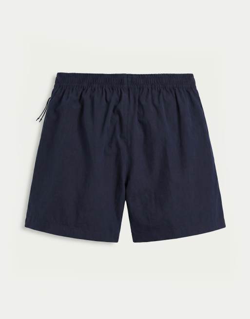ASOS DESIGN - Pantaloncini ampi lunghezza media elasticizzati in nylon blu navy con profili a contrasto, 7 di 9