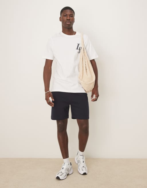 ASOS DESIGN - Pantaloncini basic slim di media lunghezza blu navy