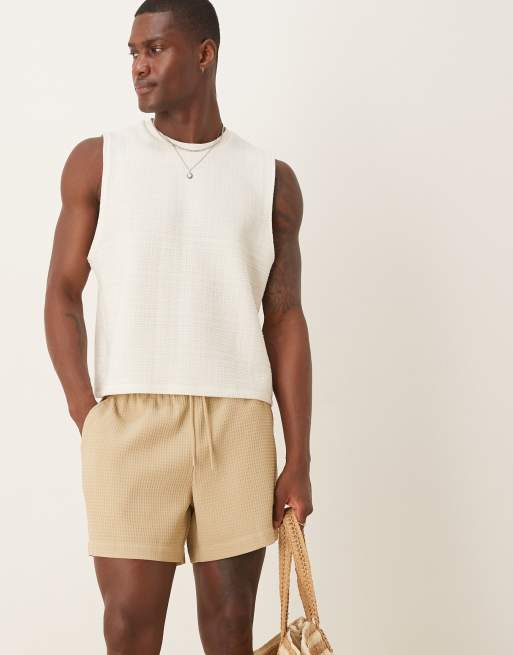 ASOS DESIGN - Pantaloncini beige a nido d'ape taglio corto