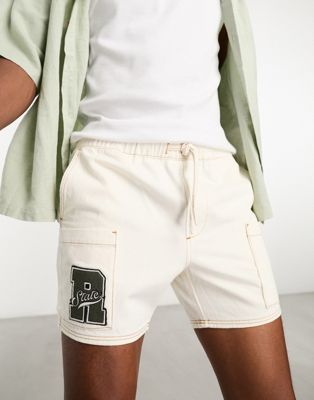 ASOS DESIGN slim shorter length denim cargo shorts with patch in ecru  - ASOS Price Checker