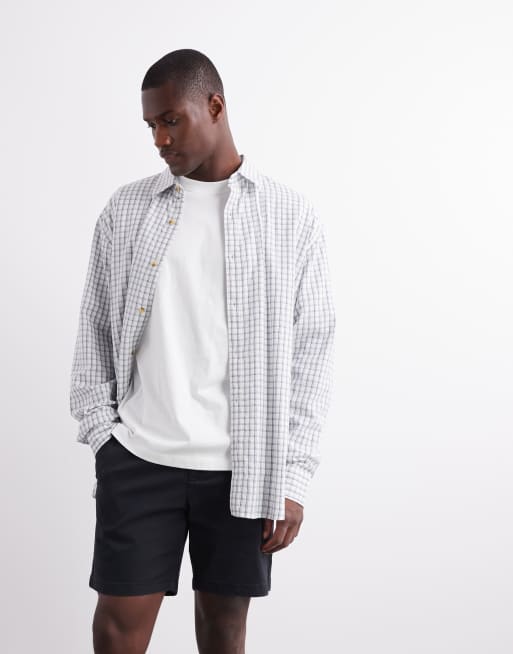 ASOS DESIGN - Pantaloncini chino ampi slim taglio medio neri