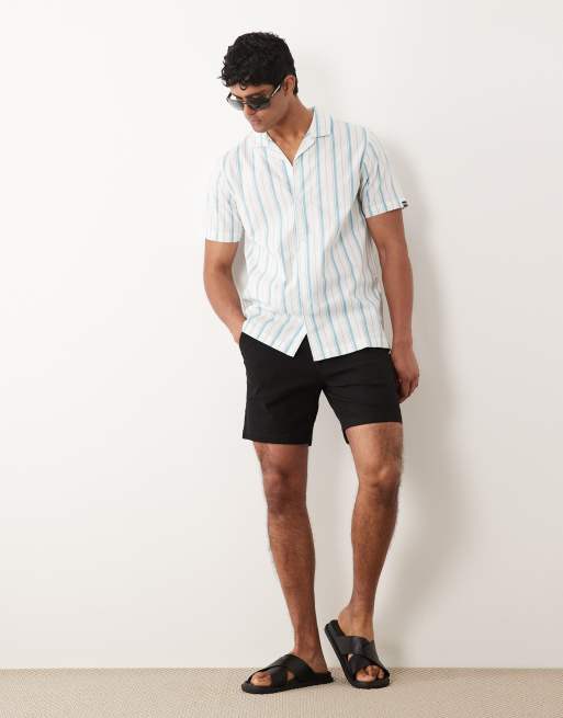 ASOS DESIGN - Pantaloncini chino slim neri taglio medio