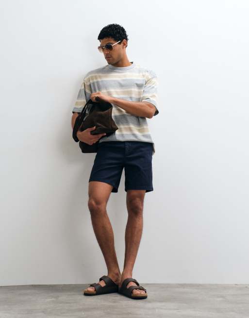 ASOS DESIGN - Pantaloncini chino slim taglio medio blu navy