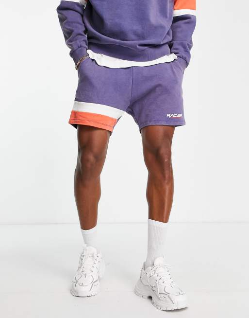 ASOS DESIGN - Pantaloncini comodi blu navy e rossi color block con stampa in coordinato