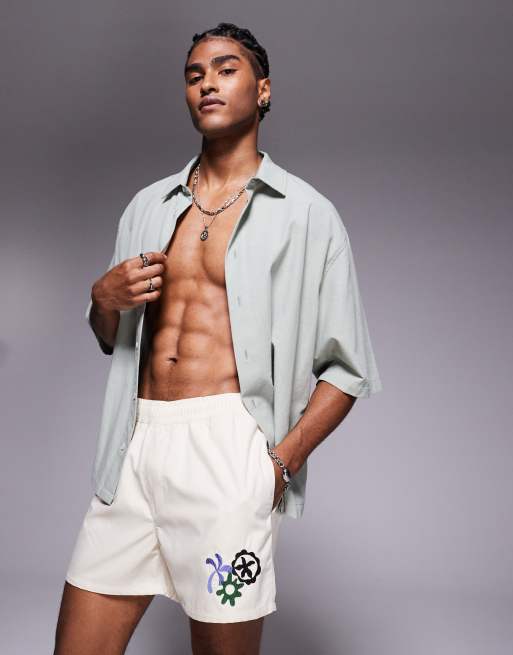 ASOS DESIGN - Pantaloncini da bagno con ricami tonalità neutra taglio corto