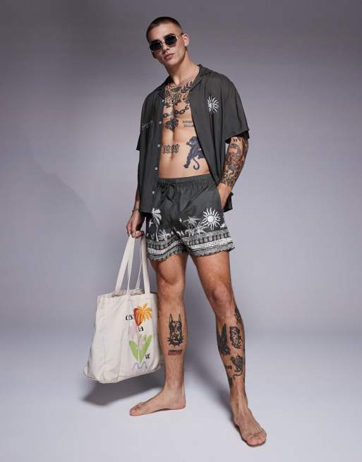 ASOS DESIGN - Pantaloncini da bagno corti verdi con grafica estiva in coordinato