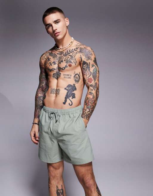 ASOS DESIGN - Pantaloncini da bagno di lunghezza media in tessuto seersucker verdi