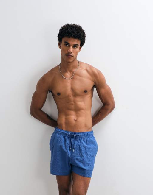 ASOS DESIGN - Pantaloncini da bagno in seersucker taglio corto blu