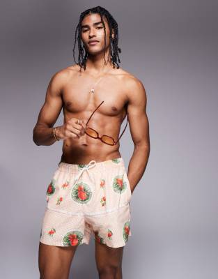 ASOS DESIGN - Pantaloncini da bagno taglio corto arancioni con stampa di frutta in coordinato