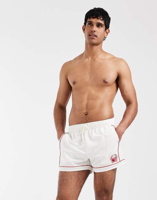 ASOS DESIGN - Pantaloncini da bagno taglio corto bianchi con profili e ricami